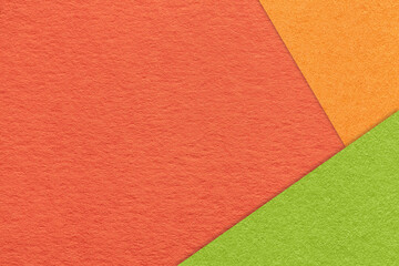 Texture craft red paper background with orange and green border. Vintage abstract ginger cardboard.