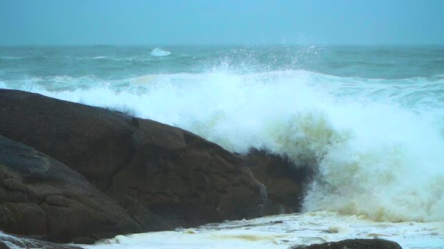 Storm swell waves crashing into the shore