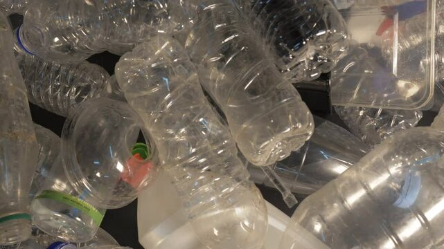 Plastic bottles dumped. A concept about reducing and recycling the microplastic pollution of "single use" plastic packaging (beverage bottles, grocery bags, straws, cups etc) that harm Earth's environ