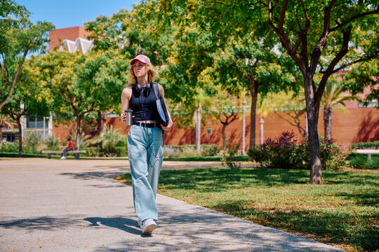 Student walking on campus path