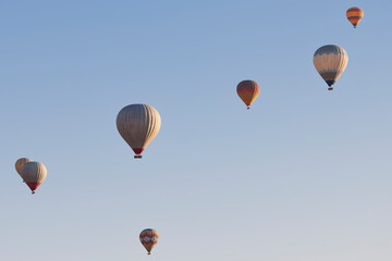 Spectacular balloons flying at sunrise in Goreme. Tourism Cappadocia, Turkey