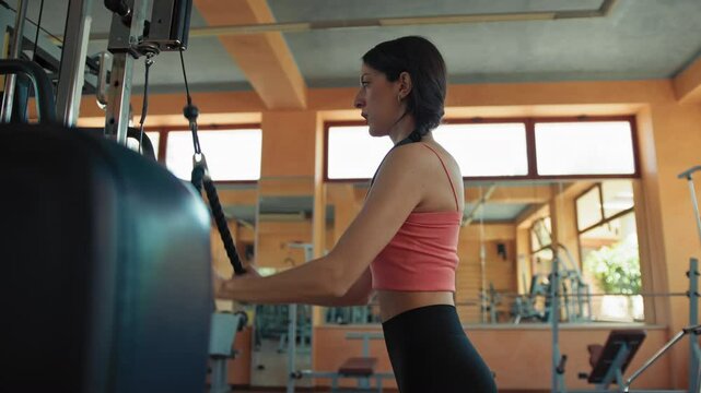 Woman Doing Triceps Pull Down Exercices