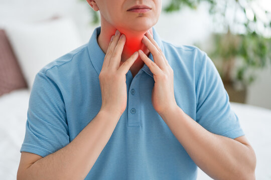 Thyroid gland inflammation, sore throat and cough, man with neck pain on gray background