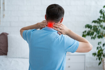 Neck pain, cervical spine hernia, man suffering from ache at home