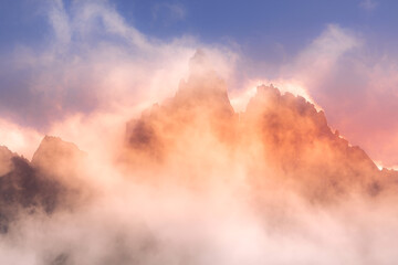 Colorful evening mountains landscape with clouds