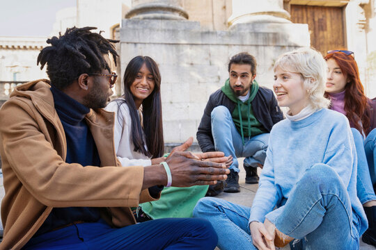 Diverse college students socializing on campus: multicultural friendship and inclusion