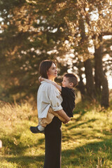 Fototapeta premium In the forest. Mother and son are together