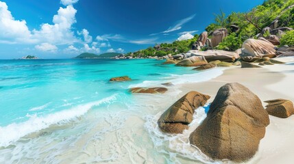 A tranquil beach on the Seychelles, with turquoise waters, white sand, and granite boulders