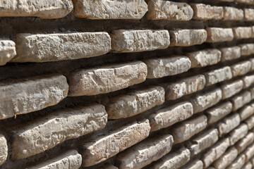 Ancient brick wall, close up perspective view, background photo