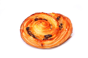 Pain aux raisins isolate on white, also called escargot or pain russe, is a spiral pastry often eaten for breakfast in France. Its names translate as 