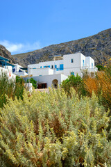 Greek holiday houses on a hillside in Aegiali on the island of Amorgos. Cyclades, Greece