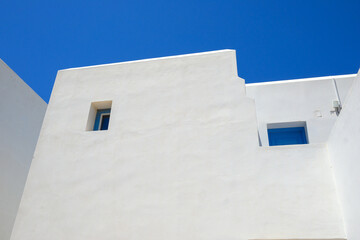 Facade of whitewashed Greek house in traditional Cycladic style. Amorgos island. Greece