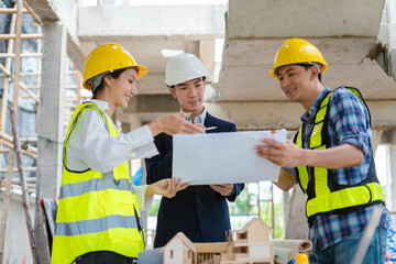 Group architect team on construction site inspection documents and business workflow in the morning.