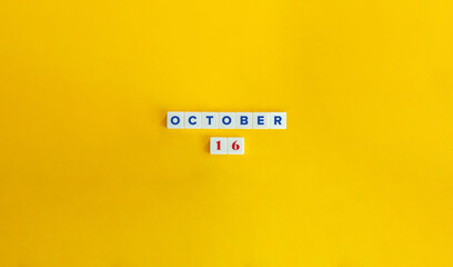 October 16. Text on Block Letter Tiles on Yellow Background. Minimal Aesthetics.