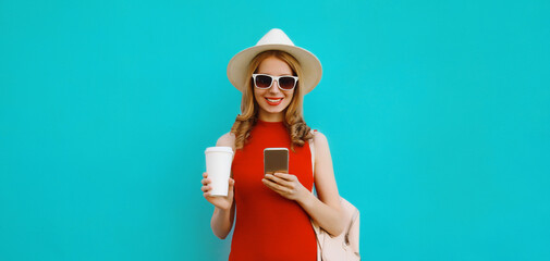 Stylish happy young woman with phone, modern smiling girl using smartphone in summer tourist hat