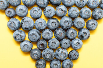Fresh blueberry on yellow background