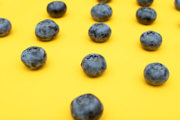 Fresh blueberry on yellow background