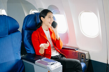 Asian Woman Working on Tablet During  in first class, multitasking with Flight Travel in style, work