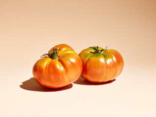 natural farm tomatoes on a beige background