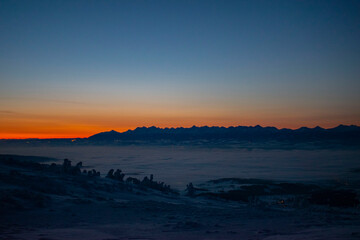 Fototapeta premium sunrise over the Tatra Mountains and snowy mountain peaks