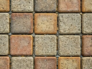 Obraz premium Rustic, weathered, single-sided cement block paving stone with intricate texture, visible aggregate, and subtle color variations, perfect for backgrounds or abstract representations.