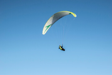 paraglider in the sky in the mountains in winter