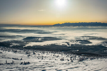sunrise over the Tatra Mountains and snowy mountain peaks