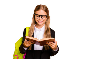 Portrait  of trendy kid hold hand textbook read have bag backpack rucksack isolated over yellow background