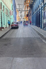 INCIDENTAL, NON RECOGNIZABLE PEOPLE IN THE IMAGE. Motorbikes and sidecar driving up Calle Hartmann Street between Calle Enramadas and Heredia Streets, locals walking both curbsides. Santiago-Cuba-498