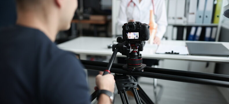 Close-up of female doctor recording vlog video about medicine and health care. Blogging or vlogging and making content concept