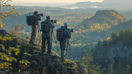 Fototapeta premium Senior Nature Photographers Capturing the Serenity of a Foggy Mountain Landscape with Professional Equipment