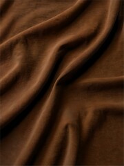 Obraz premium A brown fabric with a wavy texture
