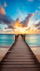 Obraz premium A serene view of a wooden pier extending into the ocean at sunrise, under a vibrant sky with dramatic clouds.