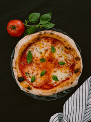 Delicious Neapolitan pizza Margherita close-up, top view