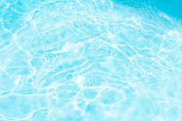 Blue water with ripples on the surface. Defocus blurred transparent blue colored clear calm water...
