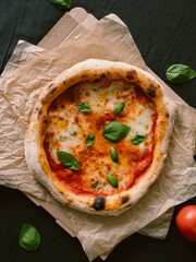 Delicious Neapolitan pizza Margherita close-up, top view