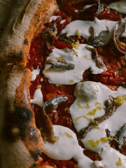 Fresh Neapolitan pizza with anchovies closeup