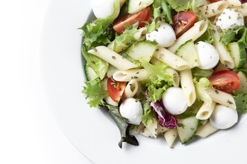 Pasta salad with vegetables and mozzarella cheese isolated on white background. Close up