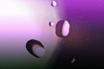 Waterdrops, water droplets on the window pane (view from the room). Ultra Macro
