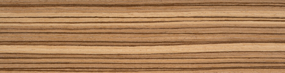 Zingana veneer surface with rich chocolate and caramel stripes in a natural linear pattern