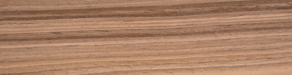 Wavy American walnut veneer surface with undulating waves of espresso and tan throughout the elegant grain