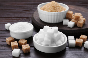 Different types of sugar on wooden table