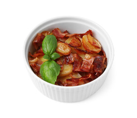 Delicious baked potatoes, bacon and basil in bowl on white background