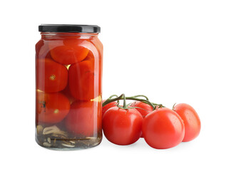 Tasty pickled tomatoes in jar and vegetable isolated on white