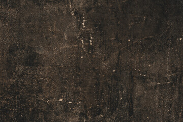 The background is made of an old worn, gray-black surface