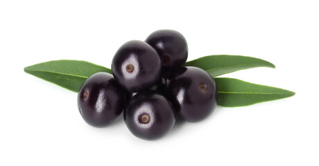 Fresh ripe acai berries and green leaves isolated on white