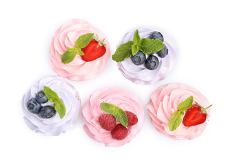 Tasty cupcakes with different berries isolated on white, top view