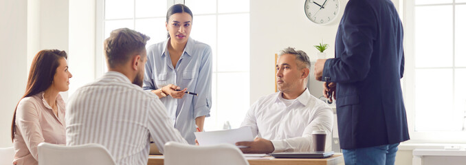 Business people talk on corporate meeting with diverse colleagues, coach mentor training employees, discussing project strategy, sharing ideas, business partners during negotiations, briefing meeting