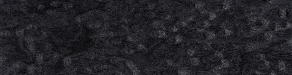Enigmatic charcoal ripples traverse this dark wood veneer, a mysterious echo of ancient, whispered woodgrain lore