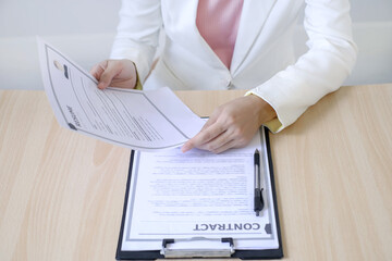 Business woman employer holding resume hiring recruit looking cv resume to hire candidates,...